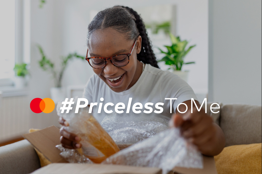 A lady winning the #Pricelesstome Mastercard and PayFast competition