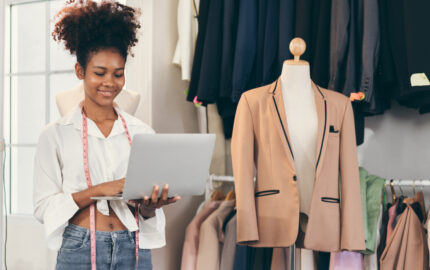 young entrepreneur holding a laptop