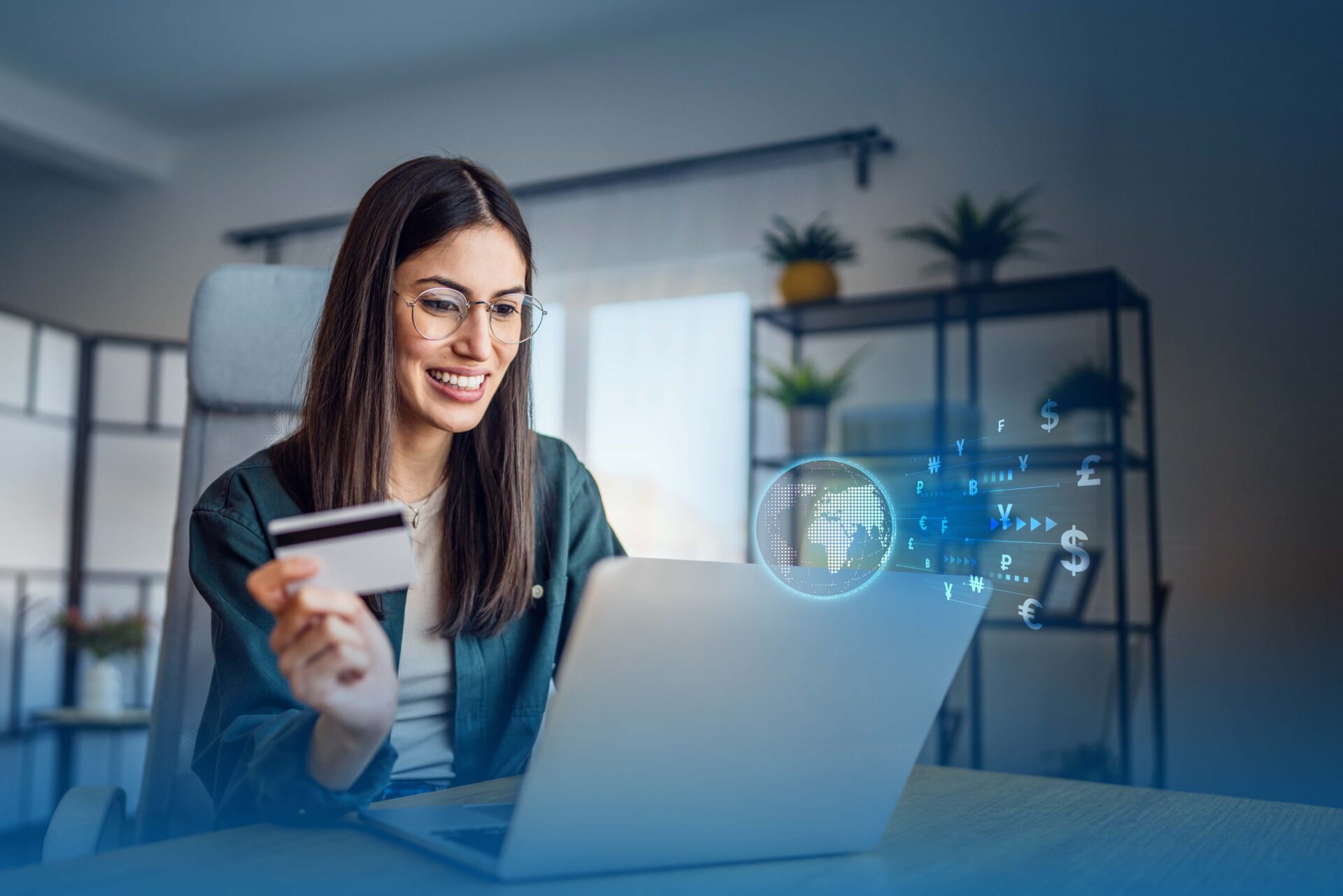Payfast multi currency pricing lady on a laptop holding a credit card